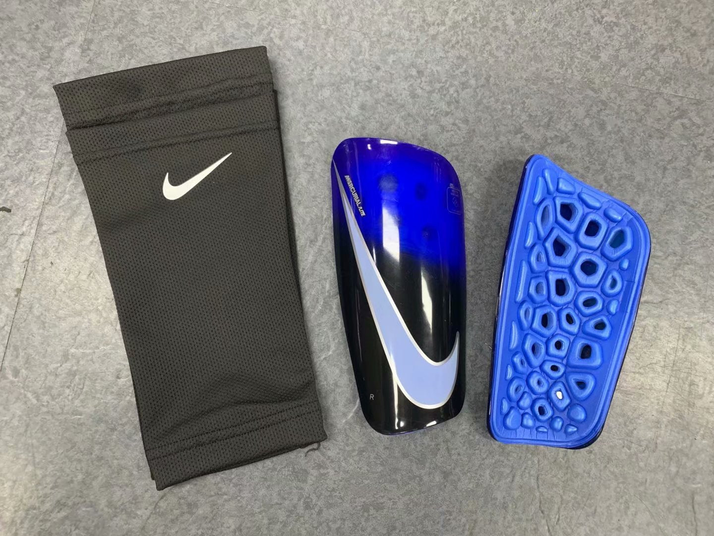 Mercurial Lite Caneleira 19/20 | Acessórios Esportivos (Entregas Acima de 20€)